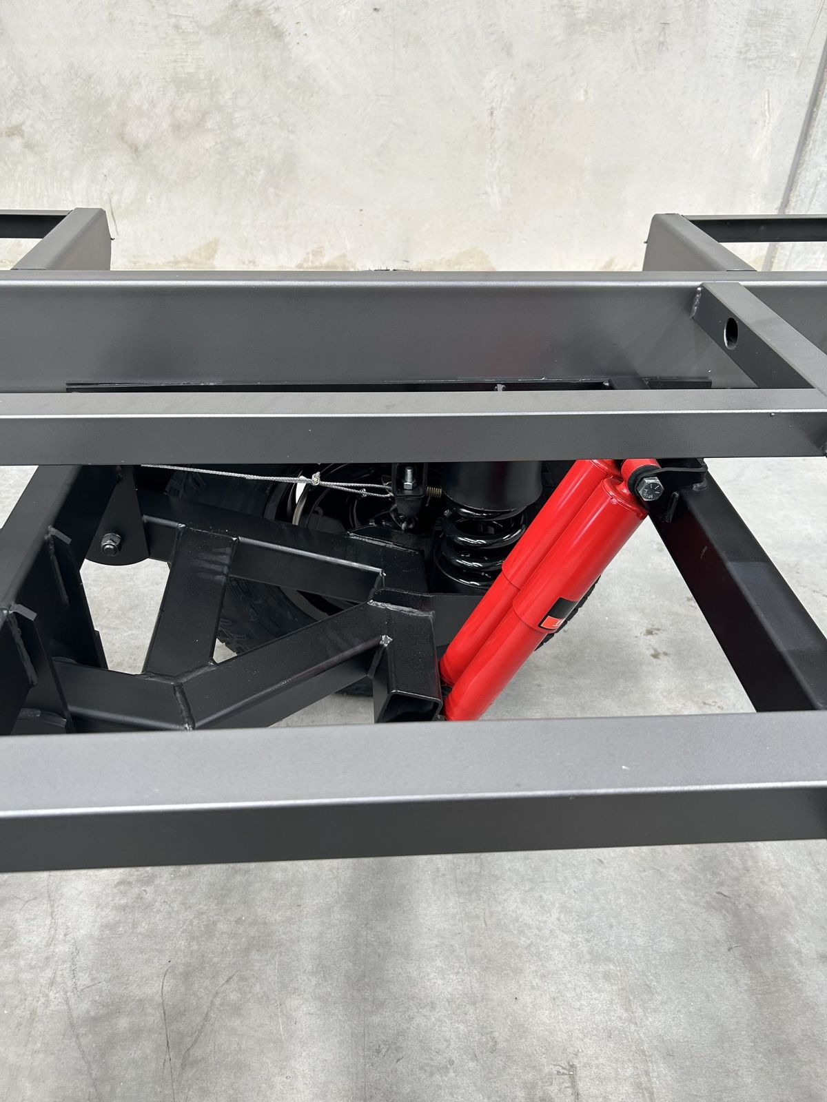 Heavy-duty galvanised caravan chassis on the factory floor