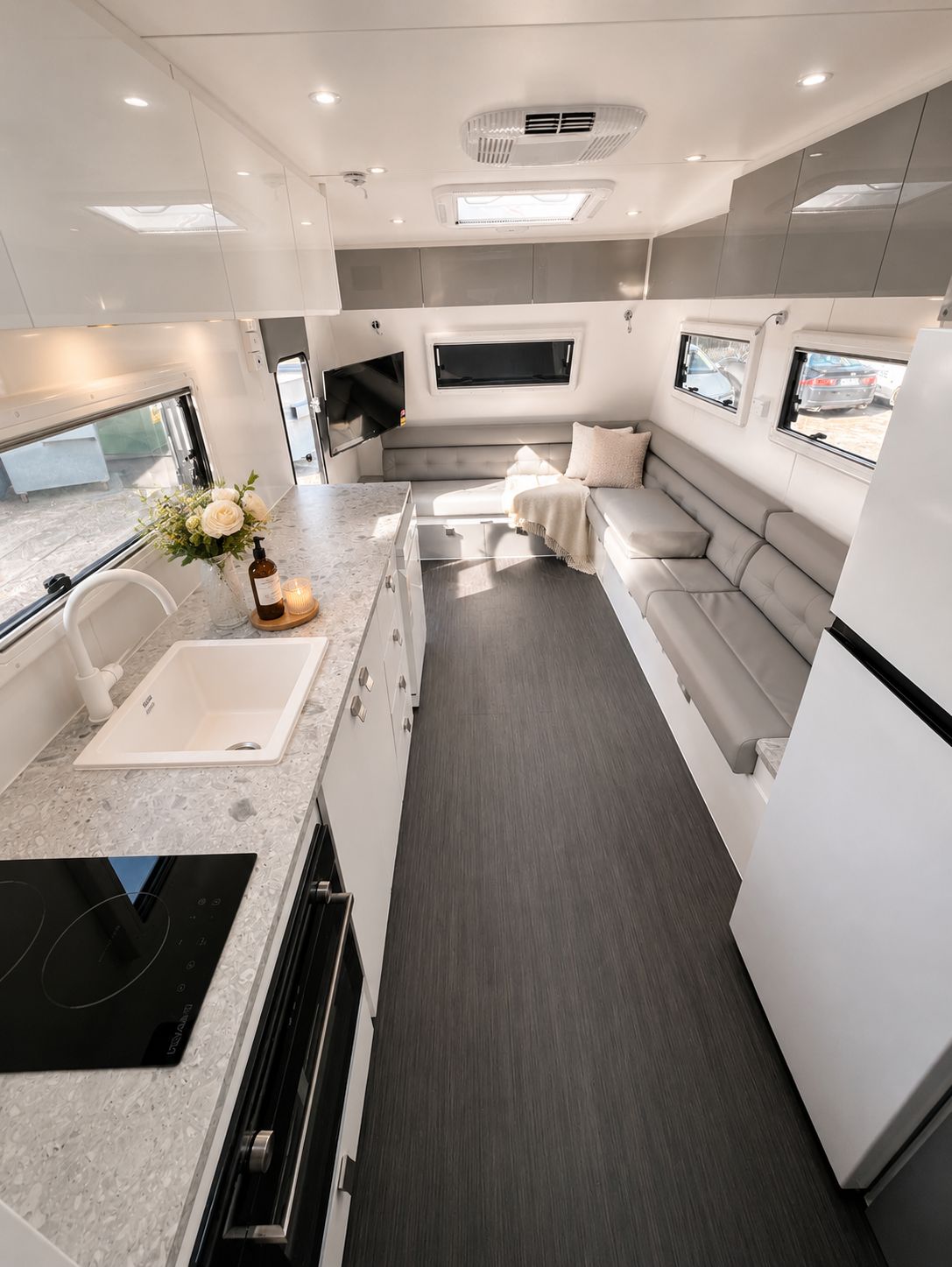 Open-plan living area with galley kitchen and lounge